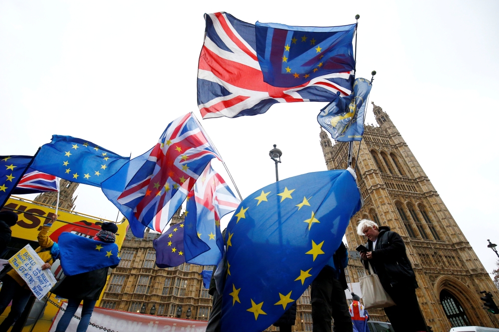 FILE PHOTO: Demonstrators protest against Brexit outside the Houses of Parliament in London, Britain, November 28, 2018. REUTERS/Henry Nicholls/File Photo