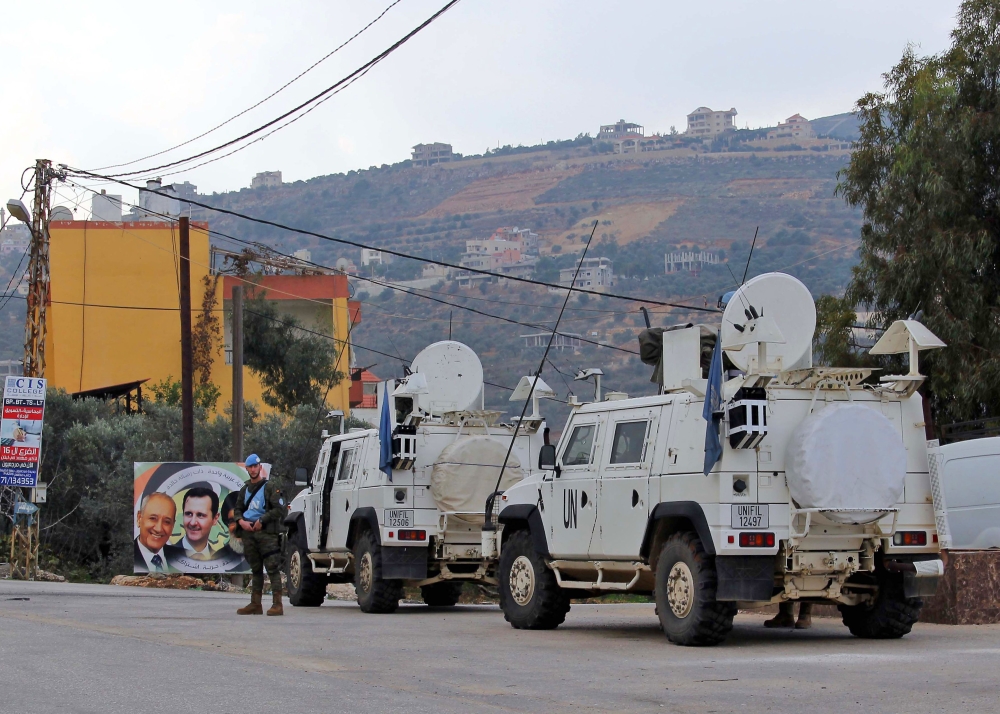 United Nations Interim Forces in Lebanon (UNIFIL) vehicles and armoured personnel carriers (APC) are seen on a road near the border between the southern Lebanese village of Kfar Kila and Israel on December 4, 2018 AFP / Ali DIA
