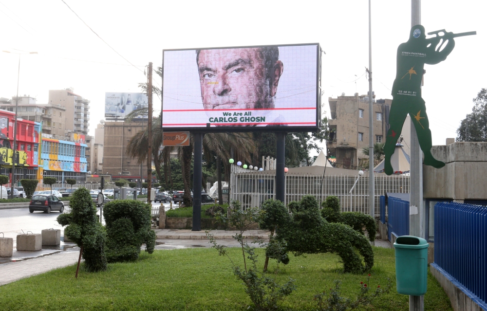 A billboard shows solidarity with Carlos Ghosn on a highway in Beirut, Lebanon December 4, 2018. REUTERS/ Mohamed Azakir