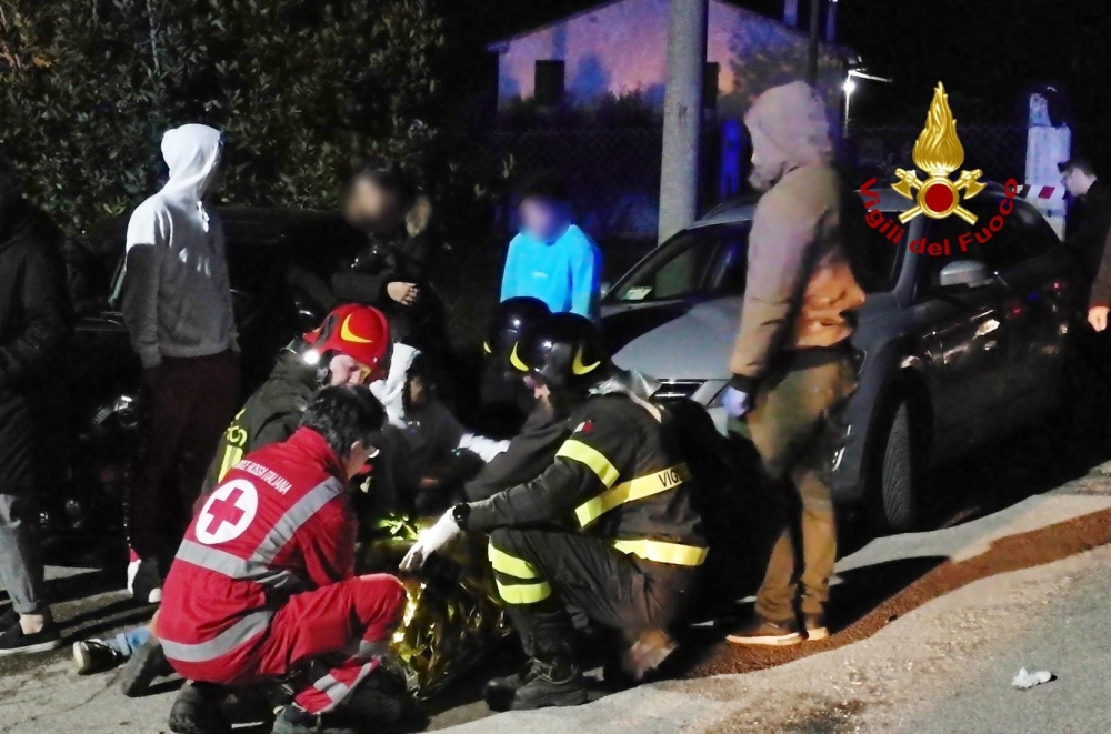 This handout picture taken and released by Vigili del Fuoco, the Italian fire and rescue service, on December 8, 2018, shows emergency personnel treating victims after a stampede at a nightclub in Cornaldo. AFP PHOTO /VIGILI DEL FUOCO