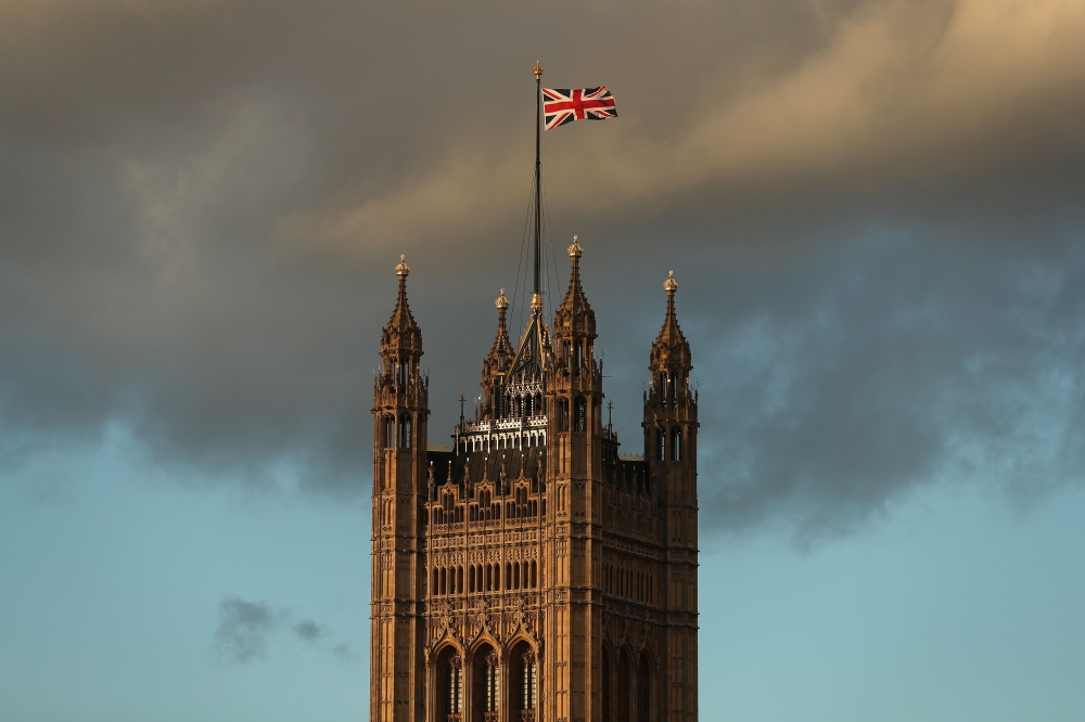 A Union flag flies from atop the Victoria Tower of the Palace of Westminster in central London, on December 7, 2018. AFP / Daniel LEAL-OLIVAS