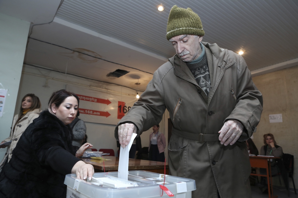 Armenian voters cast their ballot in early parliamentary election at a polling station in Yerevan, Armenia on December 09, 2018. Former Prime Minister Nikol Pashinyan resigned from his post in order for parliament to be dissolved and an early election to 