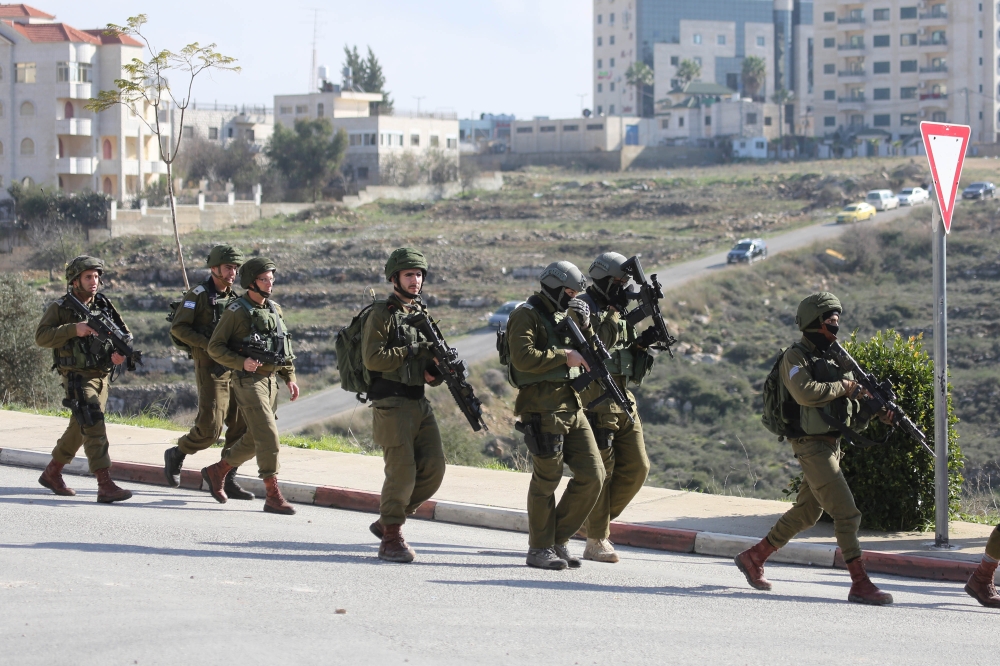 Israeli forces intervene in Palestinians during an Israeli raid in Ramallah, West Bank on December 10, 2018. (Issam Rimawi /Anadolu Agency)