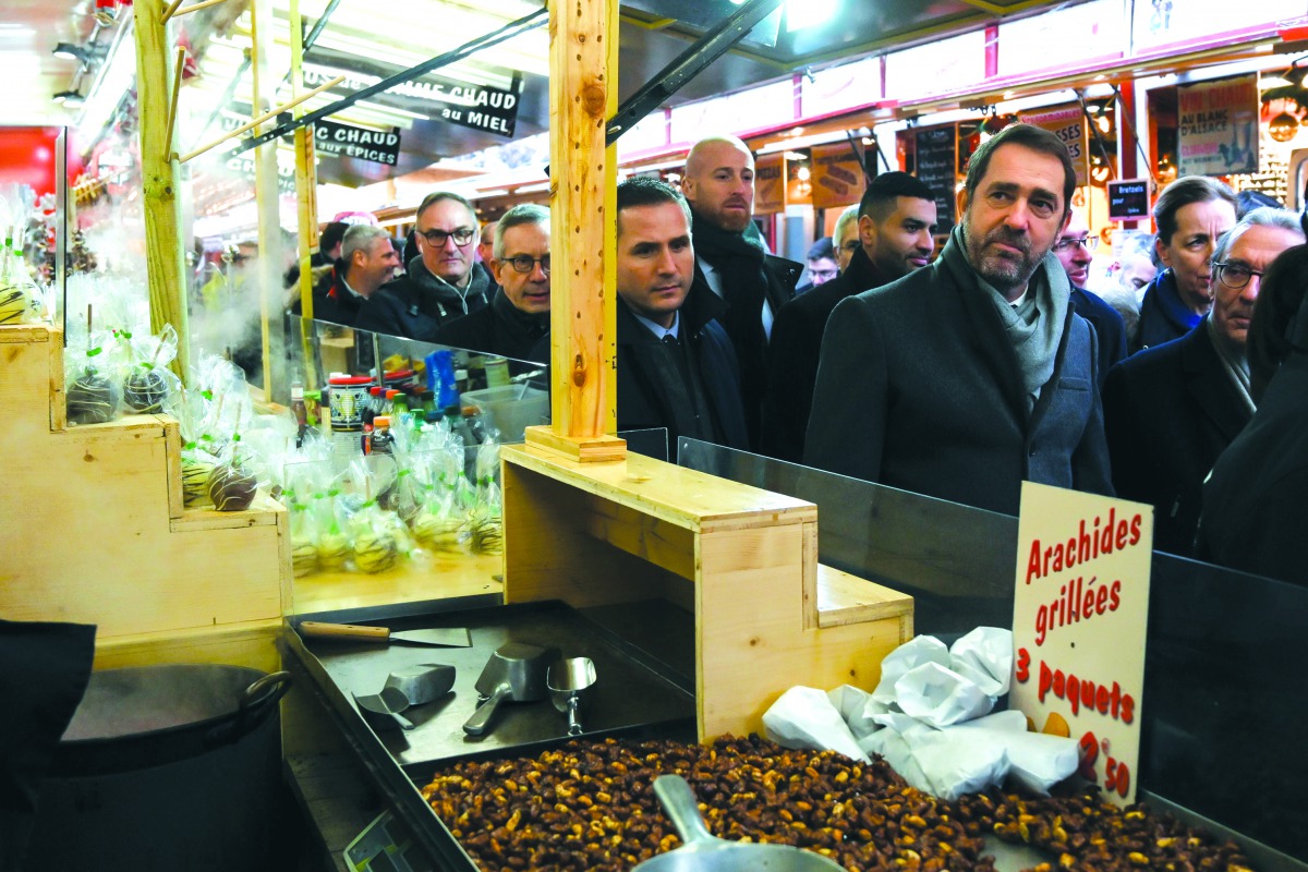 French Interior Minister Christophe Castaner (2ndR) looks on during the reopening of the christmas market of Strasbourg, eastern France, on December 14, 2018, AFP / Sebastien Bozon
