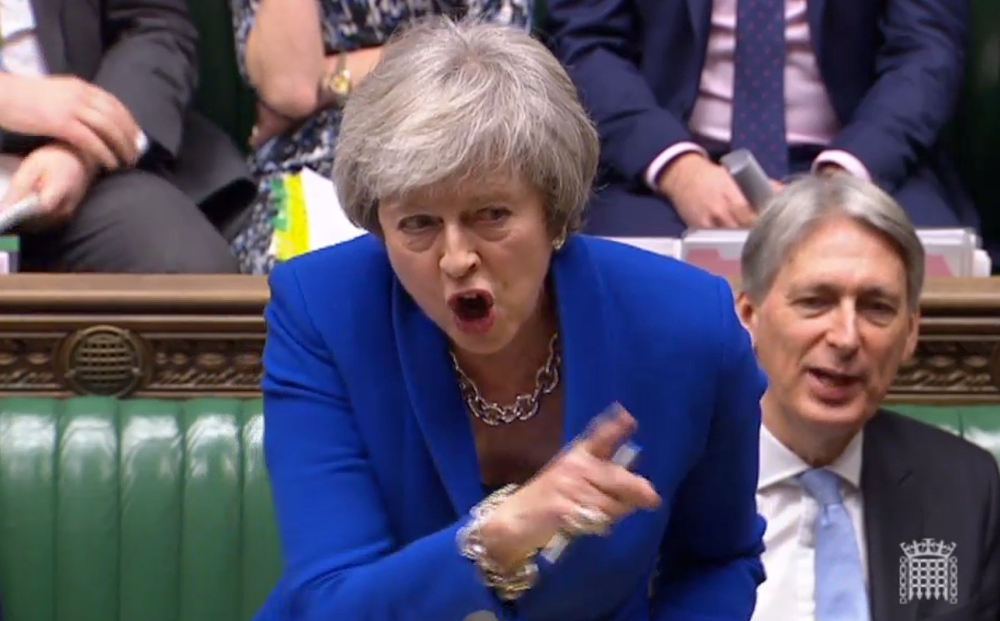  A video grab from footage broadcast by the UK Parliament's Parliamentary Recording Unit (PRU) shows Britain's Prime Minister Theresa May as she tells makes a joke about the opposition Labour party leader Jeremy Corbyn's failure to demand a no-confidence 