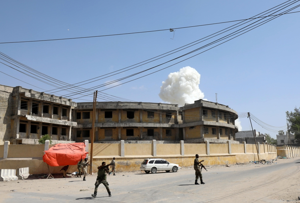 Somali security officers take position after a second explosion near the president's residence in Mogadishu, Somalia December 22, 2018. REUTERS/Feisal Omar