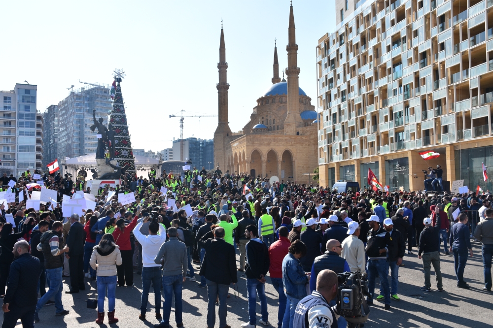 Hundreds of Lebanese demonstrators some of them wearing 