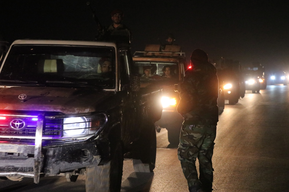 Heavy armed land and armoured vehicles belonging to Hamza division affiliated with Free Syrian Army (FSA) are being dispatched to the front lines in Manbij at the border with YPG/PKK terrorist organizations and Asad regime forces, on December 24 in Azez, 