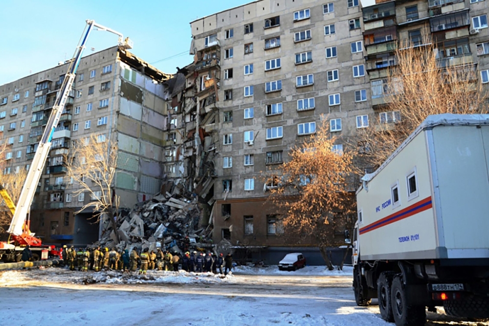 Emergency officers as they gather after a gas explosion rocked a residential building in Russia's Urals city of Magnitogorsk. AFP PHOTO 