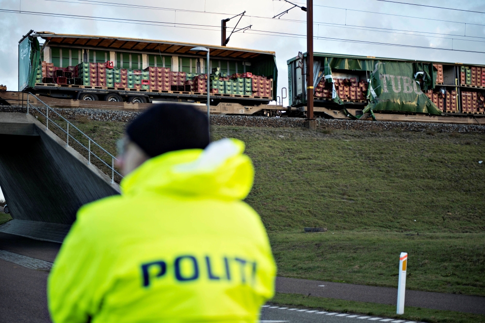 Police keep guard after a train accident on the Great Belt Bridge in Denmark, January 2, 2019. Michael Bager/Ritzau Scanpix 
