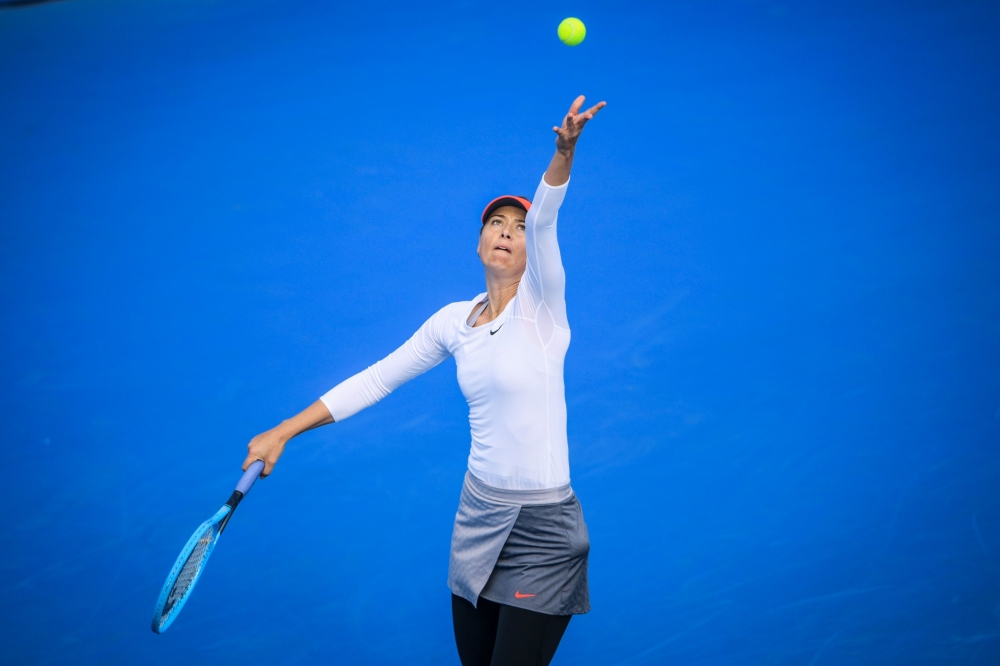 Maria Sharapova of Russia serves to Timea Bacsinszky of Switzerland in their women's singles first round match of the Shenzhen Open tennis tournament in Shenzhen in China's southern Guangdong province on December 31, 2018. China OUT / AFP / STR