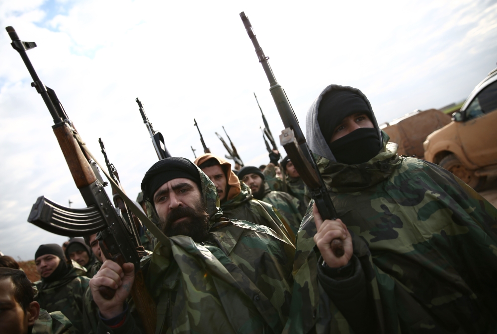 Turkish-backed Syrian fighters gather in the north of Aleppo province before heading to the Kurdish-controlled town of Manbij, on December 29, 2018. / AFP / Nazeer AL-KHATIB