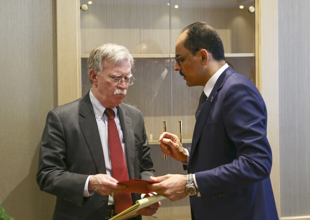 Turkish Presidential Spokesman Ibrahim Kalin (R) speaks with U.S. National Security Adviser John Bolton (L) after their meeting at the Presidential Complex in Ankara, Turkey on January 08, 2019. Halil Sa??rkaya - Anadolu