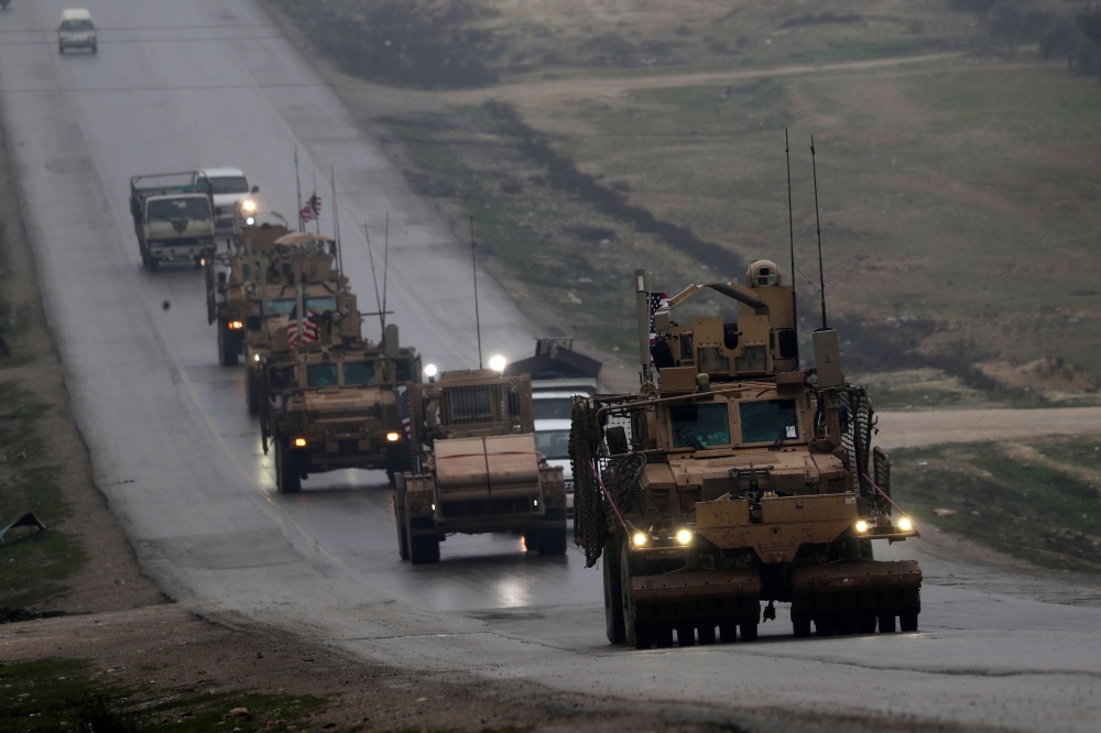 In this file photo taken on December 30, 2018 a convoy of US military vehicles rides in Syria's northern city of Manbij. (AFP / Delil SOULEIMAN)