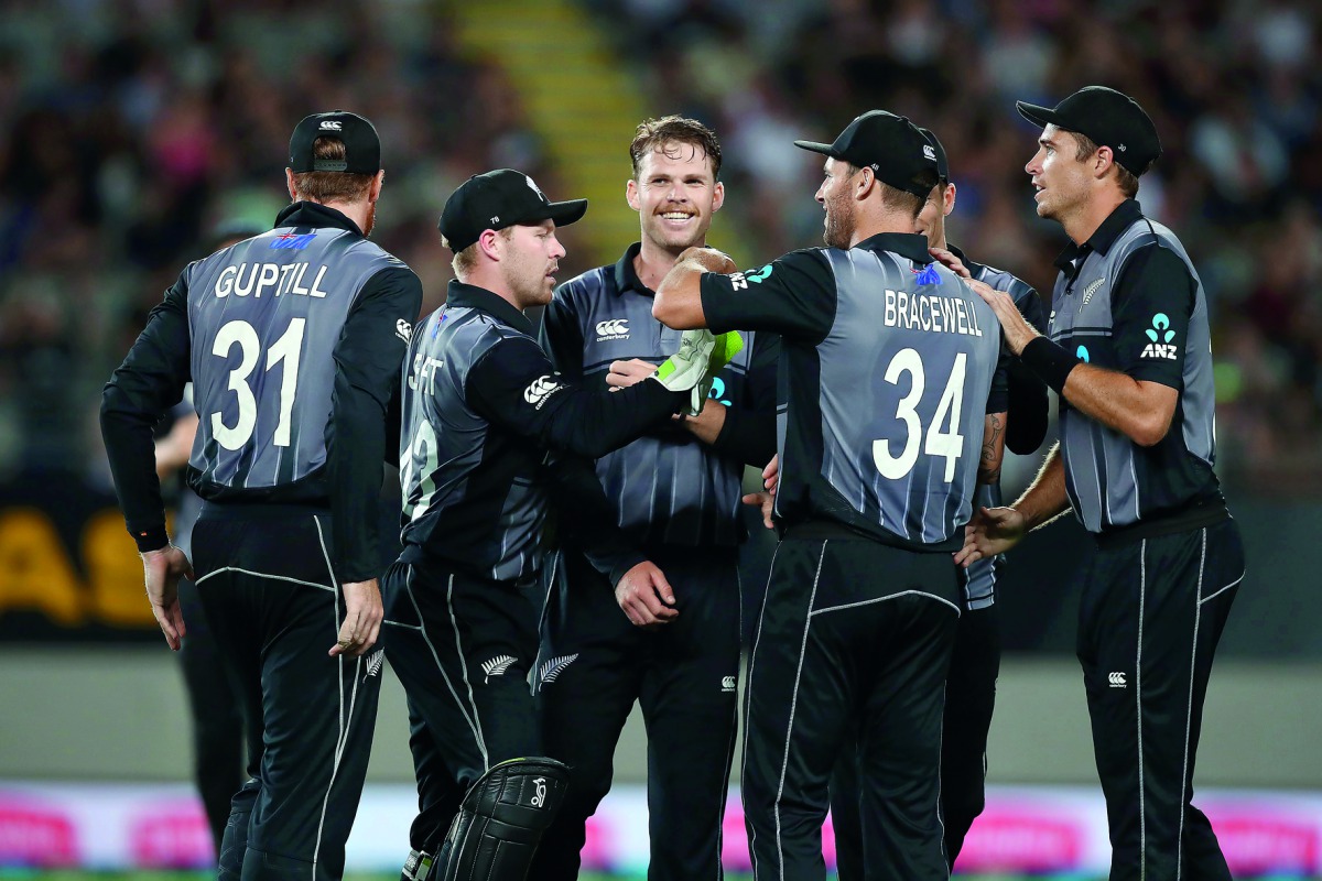 New Zealand's players celebrate taking a wicket during the International Twenty20 Cricket match between New Zealand and Sri Lanka at Eden Park in Auckland on January 11, 2019. AFP / Fiona Goodall