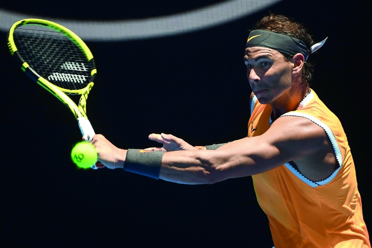 Spain's Rafael Nadal hits a return against Australia's James Duckworth during their men's singles match on day one of the Australian Open tennis tournament in Melbourne on January 14, 2019. AFP / Jewel Samad 