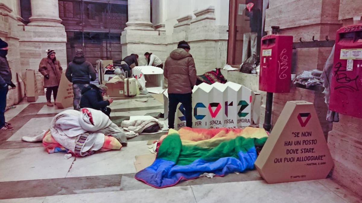 Activists hand out foldable cardboard tents to homeless people in Naples, Italy in this undated handout photo. 