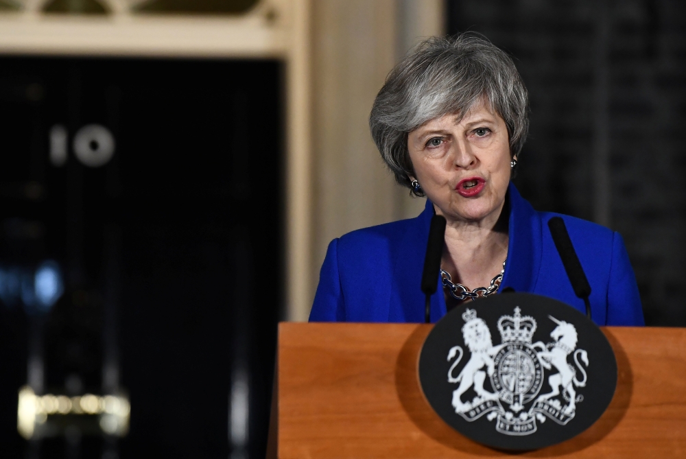Britain's Prime Minister Theresa May makes a statement following winning a confidence vote, after Parliament rejected her Brexit deal, outside 10 Downing Street in London, Britain, January 16, 2019. REUTERS/Clodagh Kilcoyne