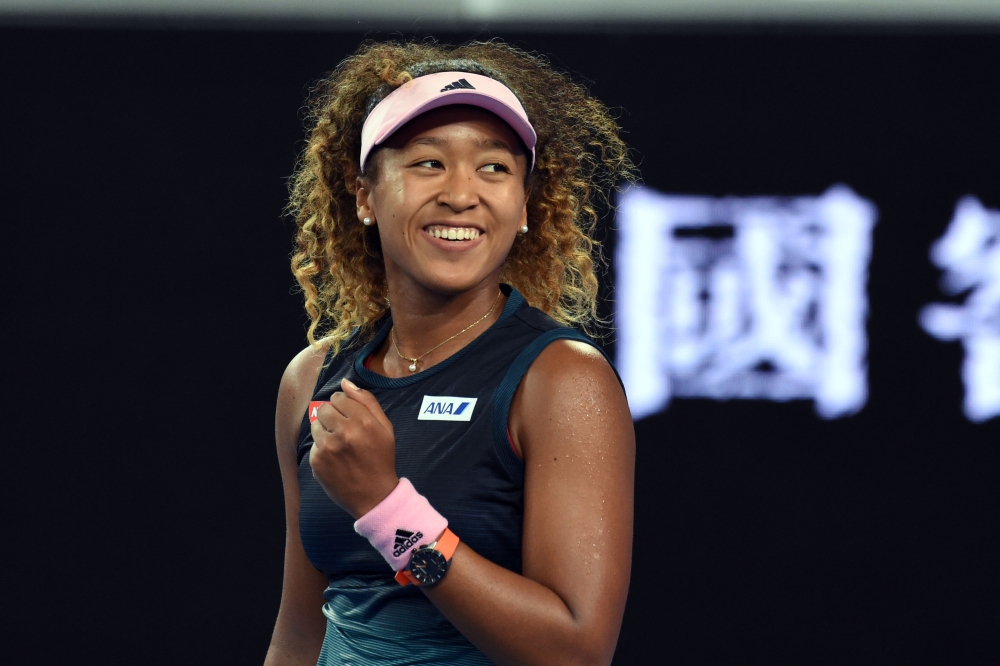 Japan's Naomi Osaka reacts after match point against Slovenia's Tamara Zidansek during their women's singles match on day four of the Australian Open tennis tournament in Melbourne on January 17, 2019. AFP / Greg Wood 