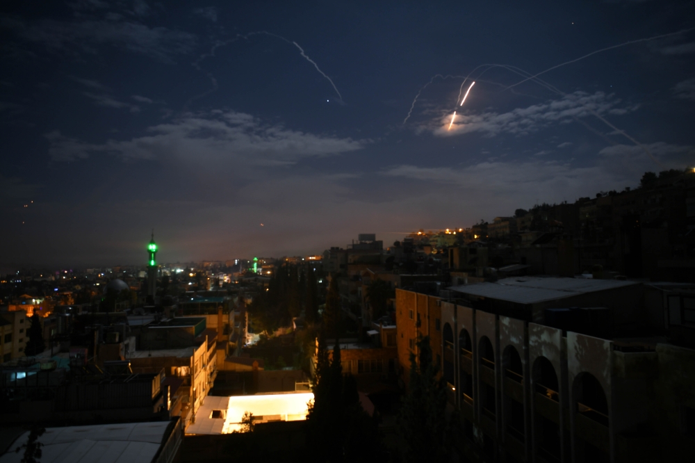 A picture taken early on January 21, 2019 shows Syrian air defence batteries responding to what the Syrian state media said were Israeli missiles targeting Damascus. AFP / STR