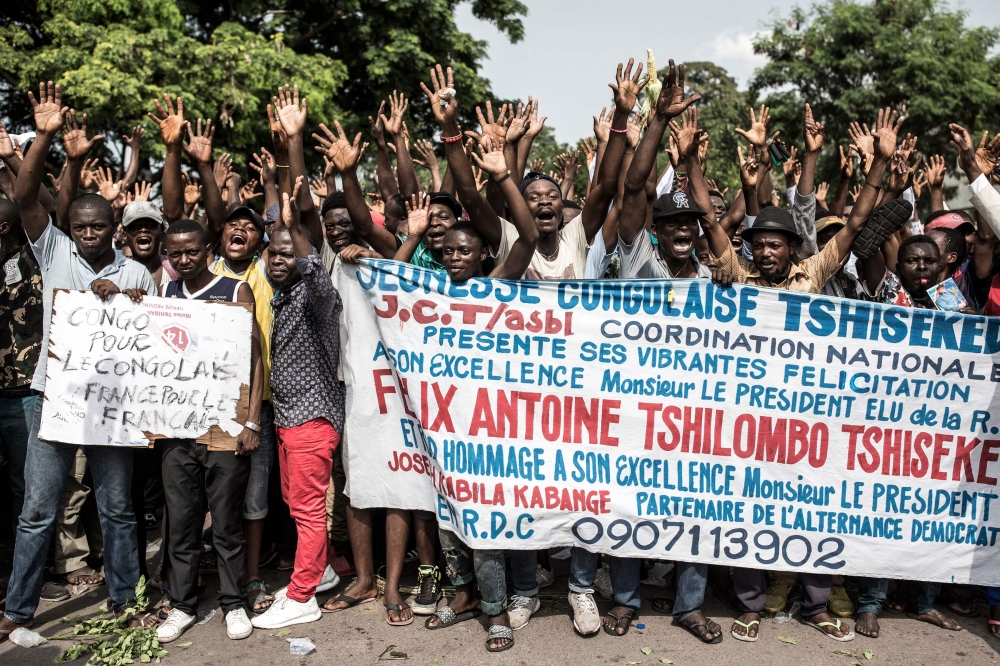 Supporters of Felix Tshisekedi, DR Congo's opposition politician declared winner of the December's presidential poll, sing and dance ahead of the Constitutional Court final decision on the presidential results, in Kinshasa, on January 19, 2019.  AFP / Joh