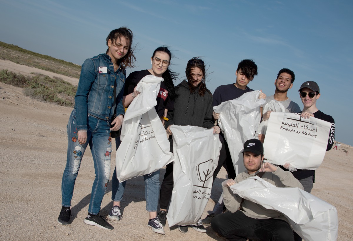 Students during a beach cleanup campaign.