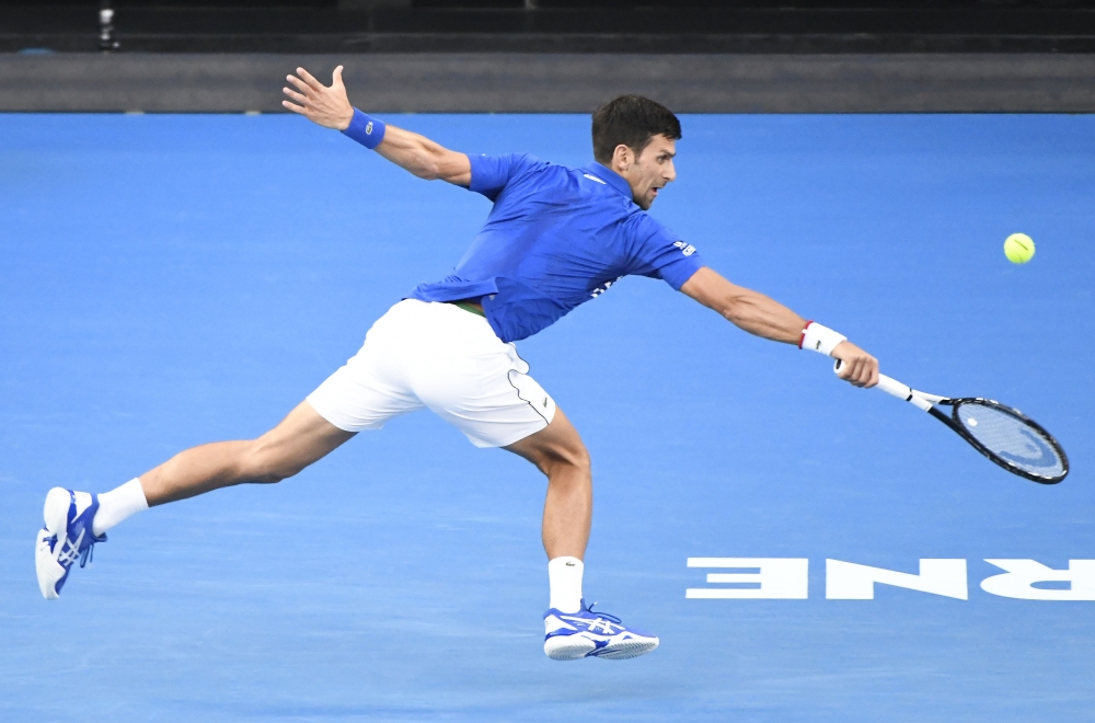 Novak Djokovic of Serbia in action against Kei Nishikori (not seen) of Japan during Australian Open 2019 Men's Singles match in Melbourne, Australia on January 23, 2019. Djokovic advanced to the semifinals after Nishikori retired following his injury. ( R