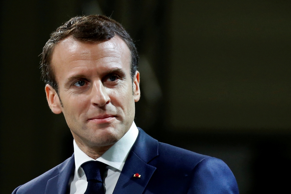 File photo of French President Emmanuel Macron reacts after he delivered his new year wishes to the military during a ceremony on the Toulouse-Francazal airbase in Toulouse, France, January 17, 2019. REUTERS/Regis Duvignau/File Photo