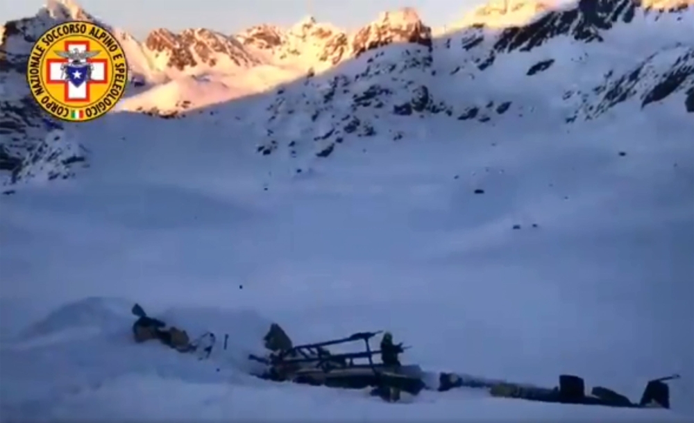 Wreckage of a helicopter after a helicopter and a private plane collided in flight above the Rutor glacier, close to La Thuile, northwestern Italian Alps.  AFP / National Alpine And Speleological Rescue Corps Aosta Valley 