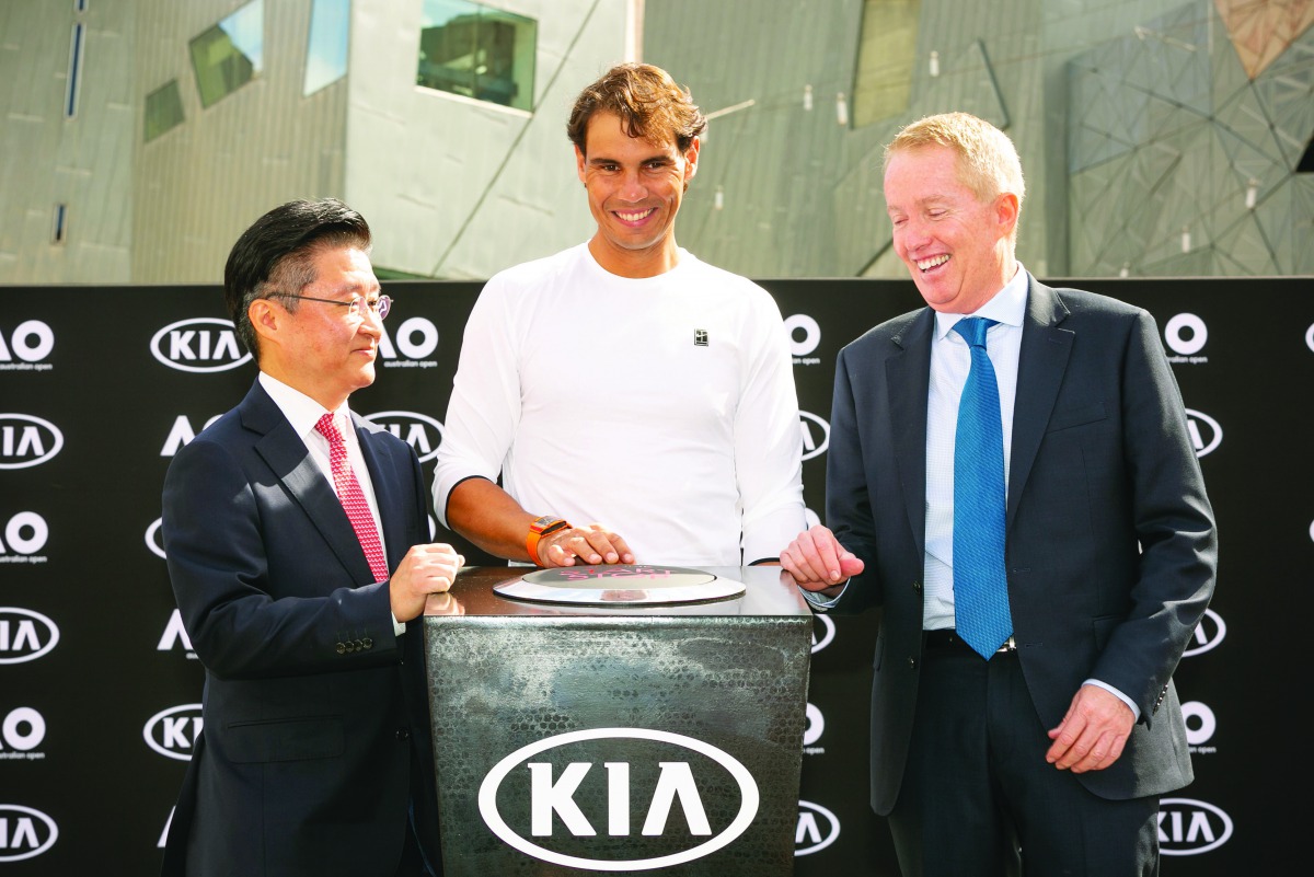 Rafael Nadal (centre) with officials of Kia Motors Corporation.
