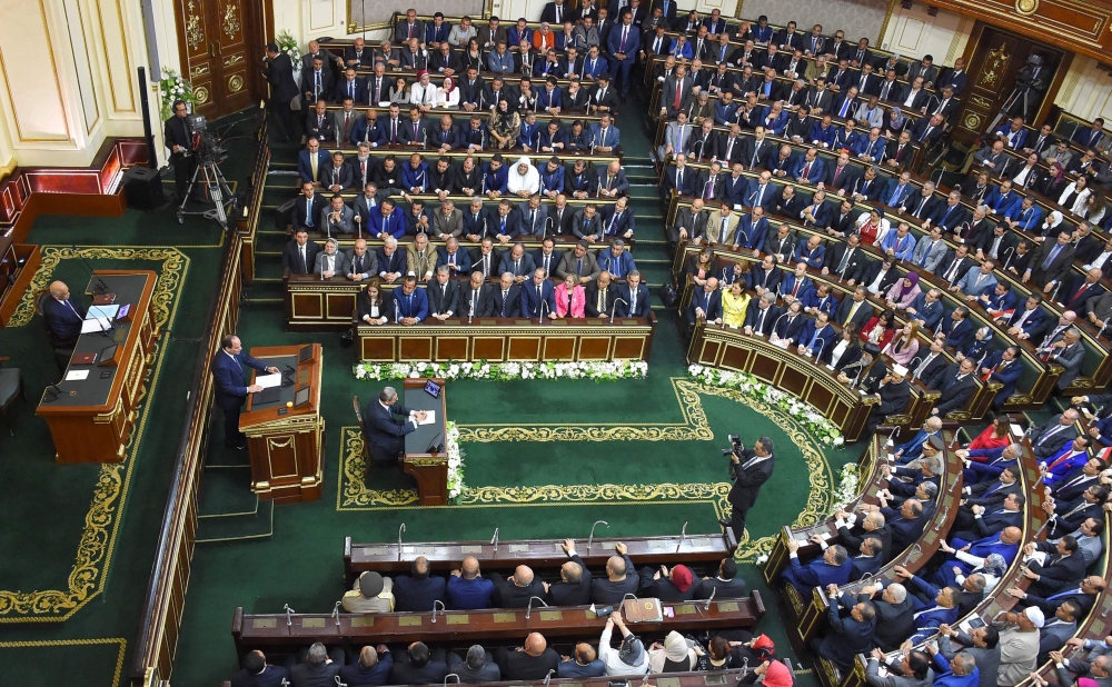 Egyptian President Abdel Fattah al-Sisi (2nd-L, centre) giving a speech during his swearing in ceremony for a second four-year term in office, at the parliament meeting hall in the capital Cairo on June 2, 2018.  AFP / Egyptian Presidency