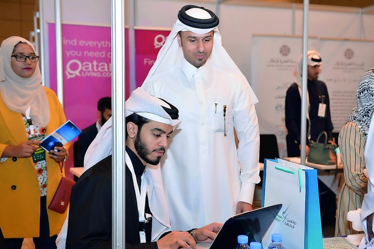 The officials are seen at the Education City Career Fair.
