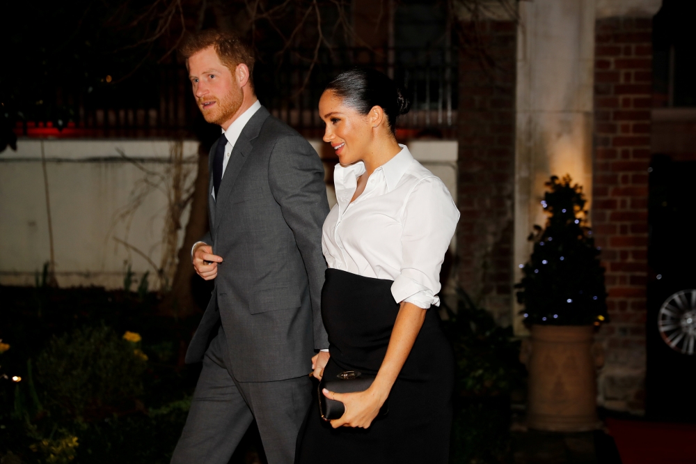 FILE PHOTO: Britain's Prince Harry and Meghan, Duchess of Sussex, arrive to attend the Endeavour Fund Awards in the Drapers' Hall in London, Britain February 7, 2019. Tolga Akmen/Pool via REUTERS/File Photo