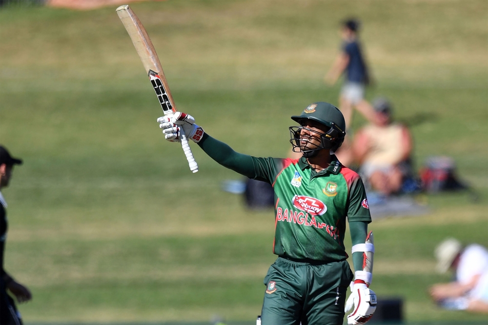 Bangladesh's batsman Mohammad Mithun celebrates reaching his half century (50 runs) during the first one-day international (ODI) cricket match between New Zealand and Bangladesh in Napier on February 13, 2019. AFP / Marty MELVILLE