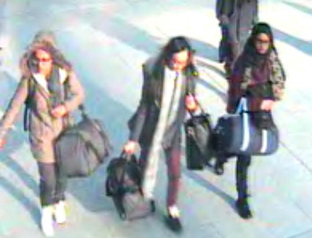 In this file photo taken on February 17, 2015 a video grab taken from CCTV, received from the Metropolitan Police Service (MPS) on February 23, 2015, shows (L-R) British teenagers Amira Abase, Kadiza Sultana and Shamima Begum at Gatwick Airport, south of 