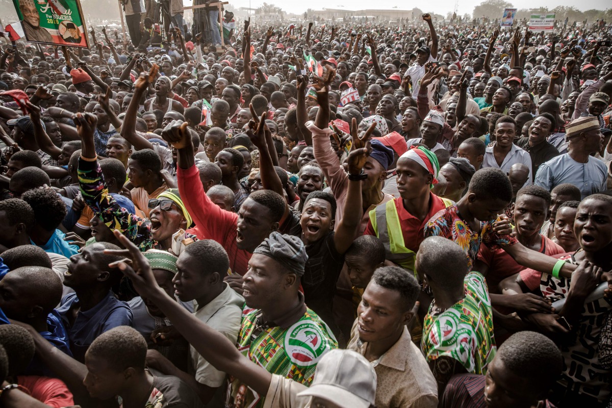 Supporters attend the final campaign rally of the Nigerian opposition Peoples Democratic Party (PDP) presidential candidate on February 14, 2019, at Ribadu Square in Jimeta, Adamawa State, eastern Nigeria, ahead of the country's presidential and legislati