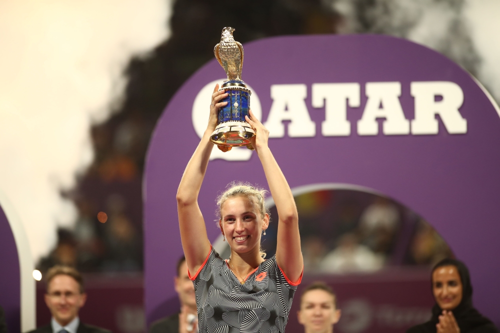 Belgian Elise Mertens poses with the trophy after her victory over Romanian Simona Halep in their WTA Qatar Open final tennis match in Doha on February 16, 2019. / AFP / KARIM JAAFAR