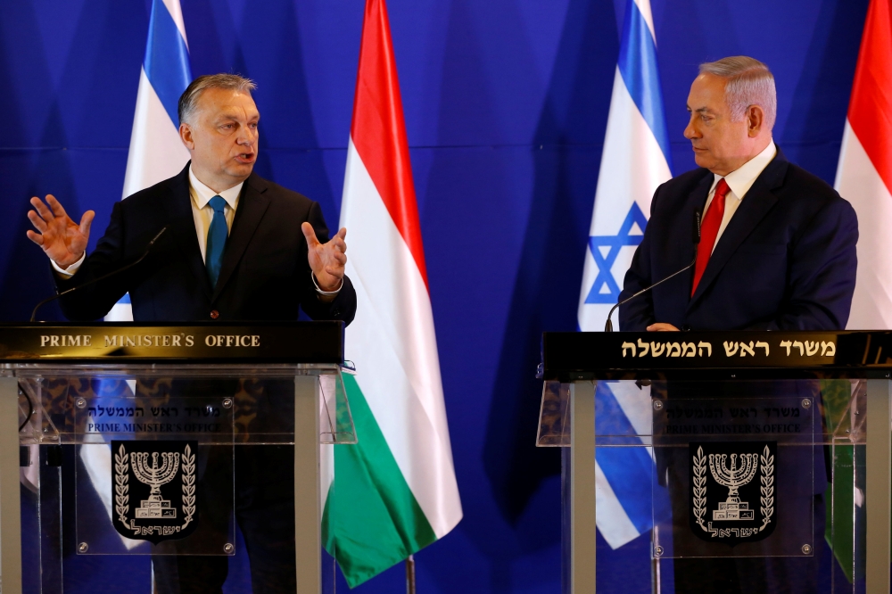 Hungarian Prime Minister Viktor Orban and Israeli Prime Minister Benjamin Netanyahu gesture as they speak to the media after their meeting in Jerusalem February 19, 2019. Ariel Schalit /Pool Via Reuters