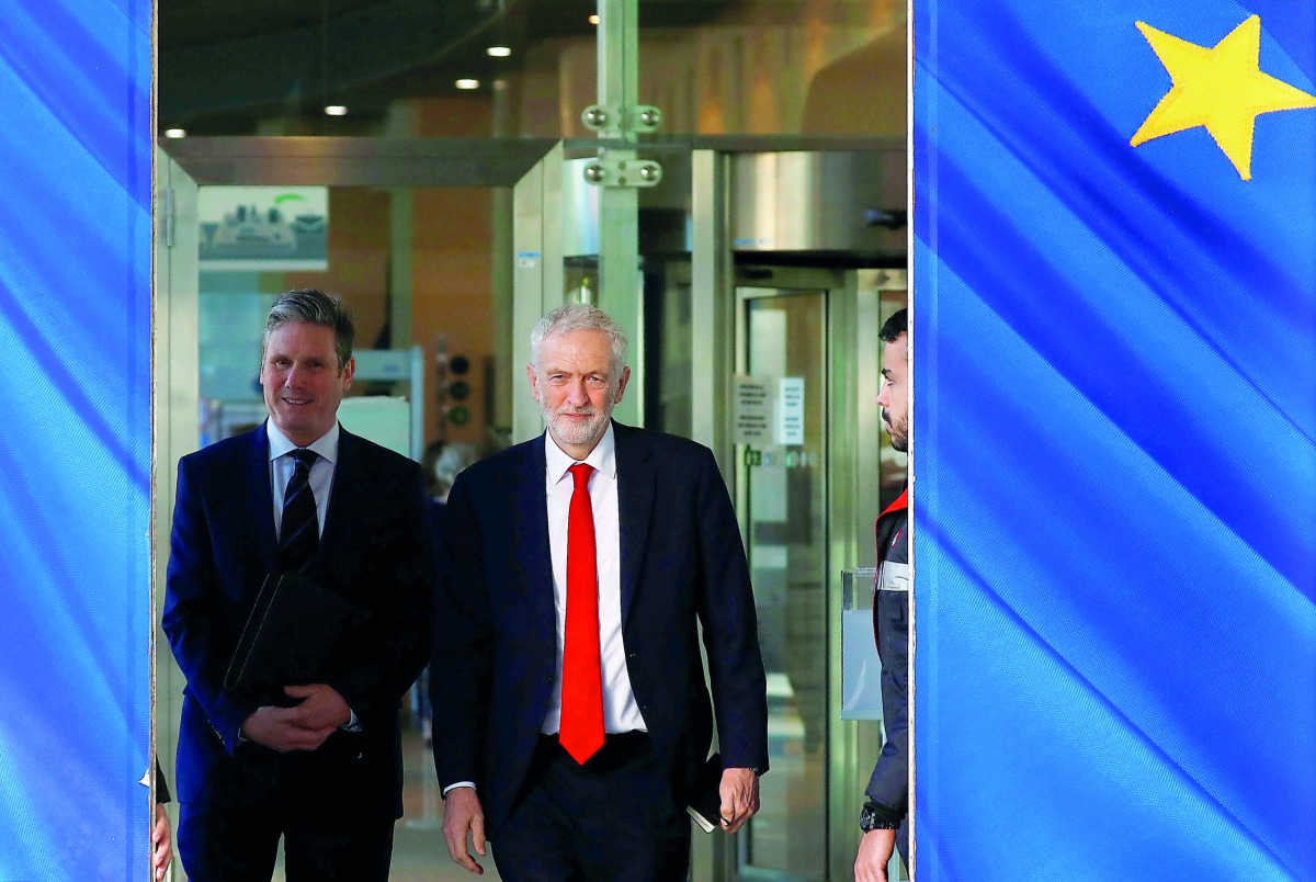 Britain's Labour Party leader Jeremy Corbyn and Labour Party's Shadow Secretary of State for Departing the European Union Keir Starmer leave a meeting with European Union Chief Brexit Negotiator Michel Barnier (not pictured) at the EU Commission headquart