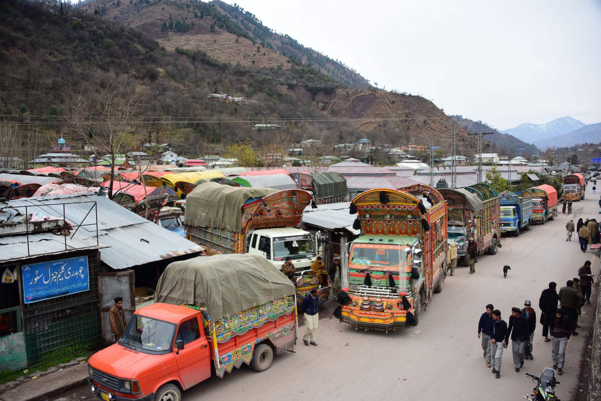 In this picture taken on February 20, 2019, goods trucks are pictured at the border town of Chakothi in Pakistan-administered Kashmir, some 3 km from Line of Control (LoC).  AFP / Sajjad Qayyum