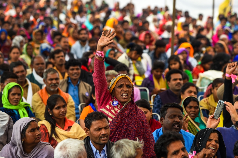 An Indian participant of the 'Dignity March' shouts slogans as the culmination of the march at Ramleela Ground in New Delhi on February 22, 2019.  AFP / Chandan Khanna