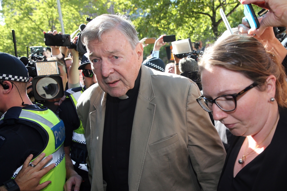 File photo of Cardinal George Pell (C) makes his way to the court in Melbourne on February 27, 2019. / AFP / Con CHRONIS
 