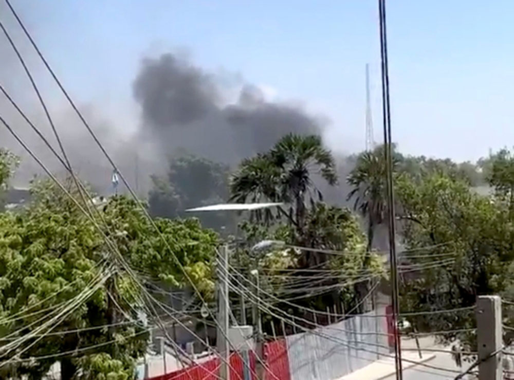 Smoke rises from an area hit by an explosion in Mogadishu, Somalia March 7, 2019 in this still image taken from a video obtained from social media. KHADAR SHIRE/via REUTERS
