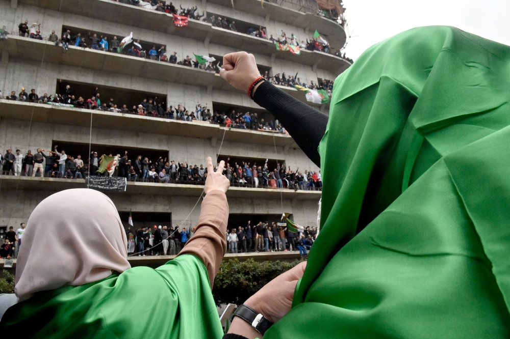 Algerian female protesters shout slogans during a demonstration in the capital Algiers against ailing president's bid for a fifth term on March 8, 2019.  AFP / RYAD KRAMDI