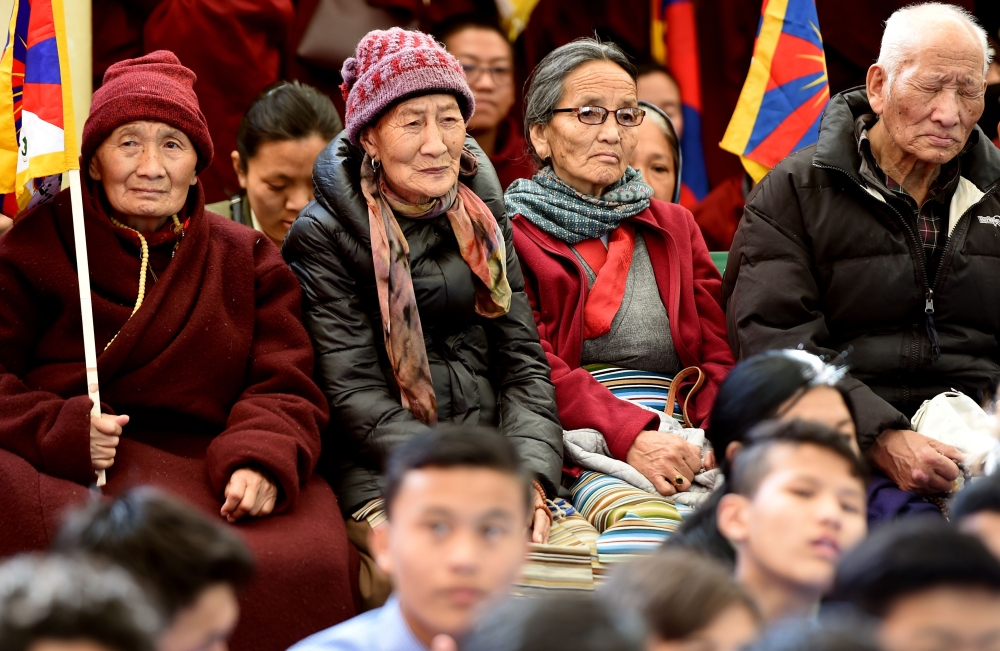 Supporters and Tibetans living in exile attend the gathering at the Dalai Lama's temple during the 60th anniversary of the Tibetan Uprising Day that commemorates the 1959 Tibetan uprising, in McLeod Ganj on March 10, 2019.  / AFP / Money SHARMA