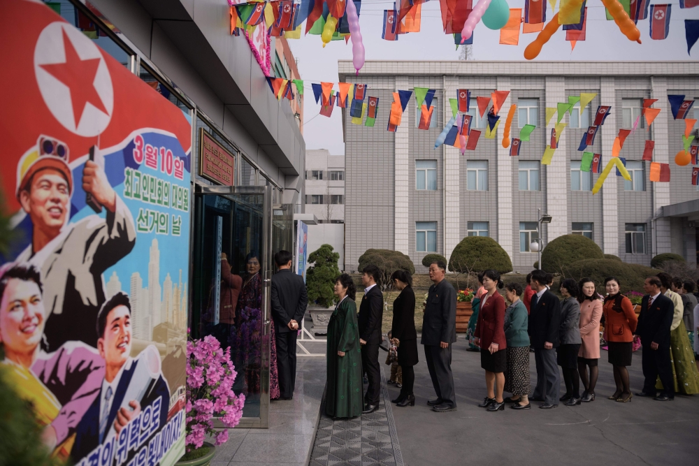 Voters queue to cast their ballots at the '3.26 Pyongyang Cable Factory' during voting for the Supreme People's Assembly elections, in Pyongyang on March 10, 2019. AFP / Ed Jones