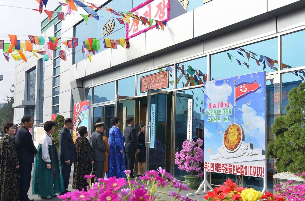 In this picture taken on March 10, 2019 and released from North Korea's official Korean Central News Agency (KCNA) on March 11, North Koreans line up to vote for the Supreme People's Assembly elections at a polling station in an undisclosed location.  