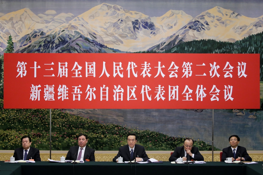 (L-R) Nayim Yasen, deputy director of the Ethnic Affairs Committee of the National PeopleÕs Congress (NPC), Shewket Imin, chairman of the Standing Committee of the Xinjiang Uighur Autonomous Region, Xinjiang Communist Party Secretary Chen Quanguo, Xinjian