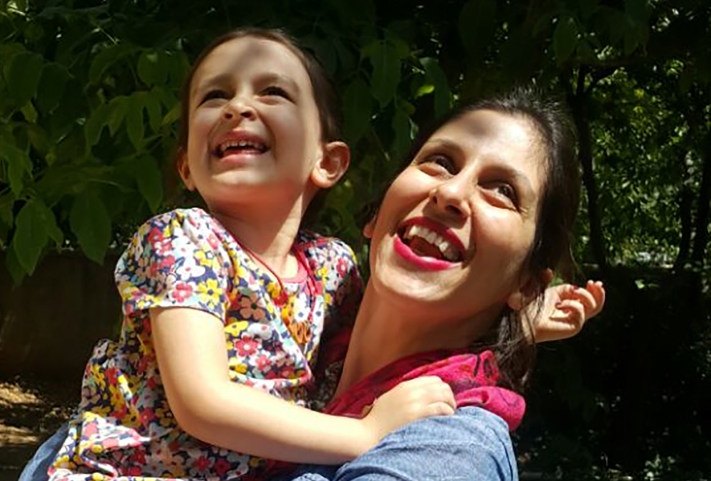 This handout picture released by the Free Nazanin campaign on August 23, 2018 shows Nazanin Zaghari-Ratcliffe (R) embracing her daughter Gabriella in Damavand, Iran following her release from prison for three days.  AFP/Free Nazanin Campaign