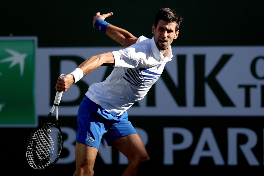 Novak Djokovic of Serbia returns a shot to Philipp Kohlschreiber of Germany during the BNP Paribas Open at the Indian Wells Tennis Garden on March 12, 2019 in Indian Wells, California. Matthew Stockman/Getty Images/AFP